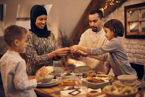A family sharing a festive home-cooked meal together for Eid